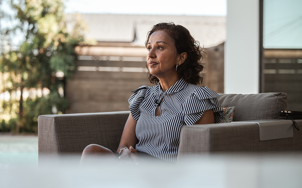 Manjusha Kulkarni, executive director of AAPI Equity Alliance, sits outside her home in Los Angeles on July 6, 2022. (Photo by Jessica Alvarado Gamez/News21)