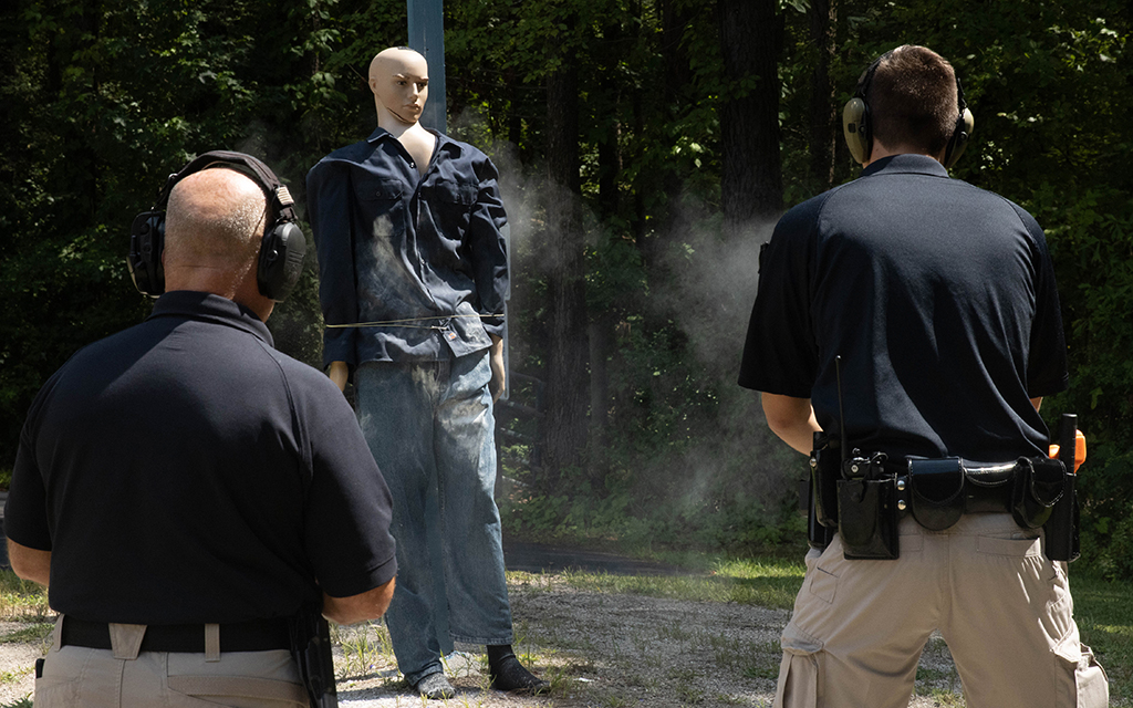 LaGrange, Georgia, police officers Jim Davidson, left, and Braxton Willis demonstrate the use of a BolaWrap restraint device on July 15, 2022. The BolaWrap, which gives officers a less-lethal tool to employ, is part of several reforms at the police department. (Photo by Donovan England/News21)