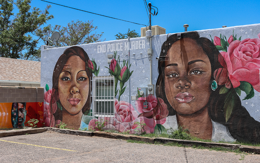 A mural outside the Albuquerque Center for Peace and Justice features images of Loreal Tsingine, left, who was fatally shot by Winslow, Arizona, police in 2016, and Breonna Taylor, who was killed in her home by police in Louisville, Kentucky, in 2020. (Photo by Kate Heston/News21)
